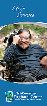 Man smiling in a motorized chair