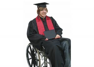 Photo of a young male graduate in cap and gown, in a wheelchair, proudly holding his diploma.