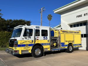 Yellow Ventura County Fire Engine 53 in front of station