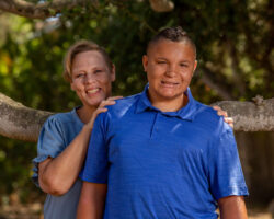 Mom stands behind pre-teen son