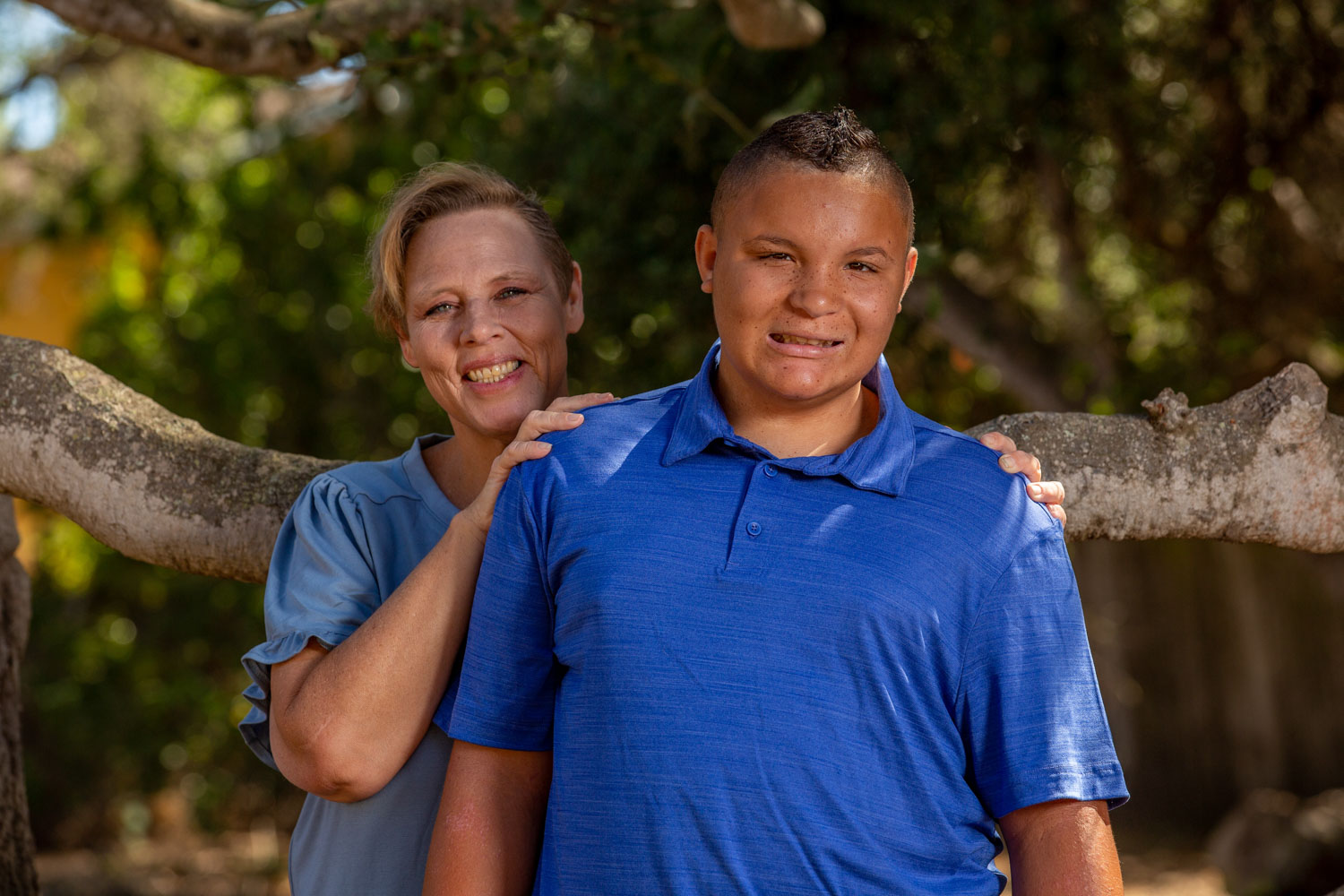 Mom stands behind pre-teen son