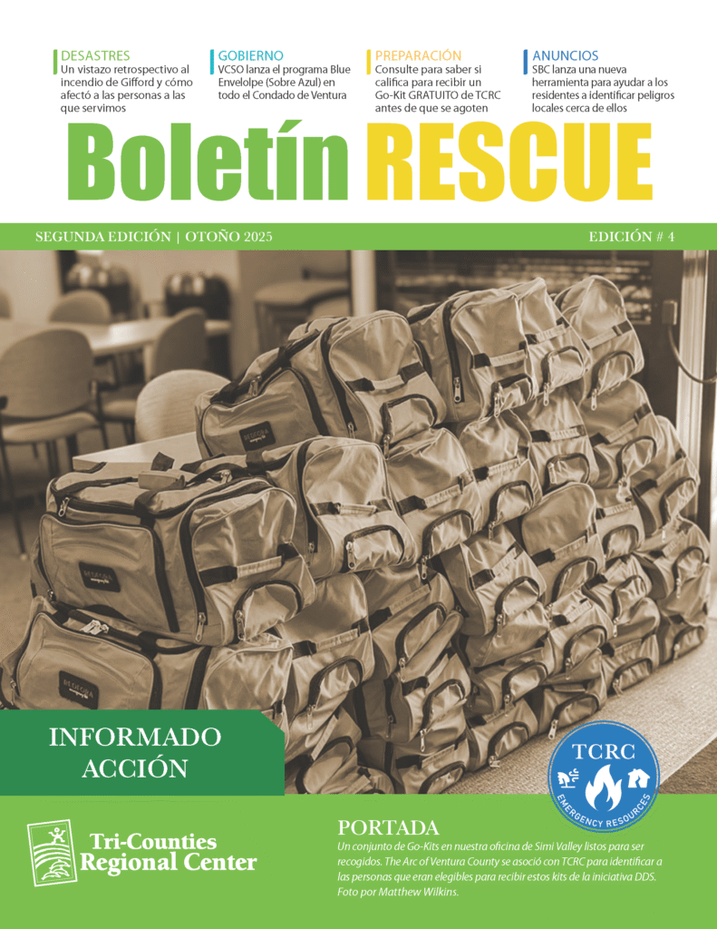 The Spanish cover of “Boletín RESCUE,” Fall 2025. A sepia-toned photo shows numerous tan emergency Go-Kits stacked on tables inside an office. Category headers at the top include Desastres, Gobierno, Preparación, and Anuncios. The bottom features the Tri-Counties Regional Center logo and a caption explaining Go-Kit distribution.